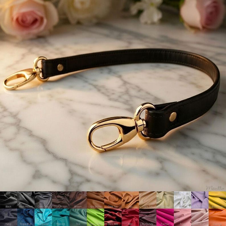 Short shoulder leather strap with clips/connector styles of your choice. Shown in black leather with gold clasps, in the crook-of-arm style.