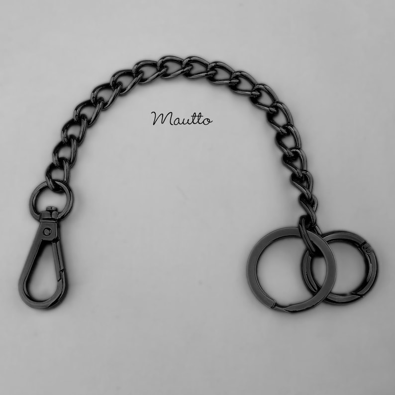 Luxury chain key fob tether and handbag accessory. Attachable clip and keyring / o-ring accessory, to secure your keys to your bag or clothing. Jewelry quality metal chain. Made by hand in the USA. Gunmetal black finish shown.