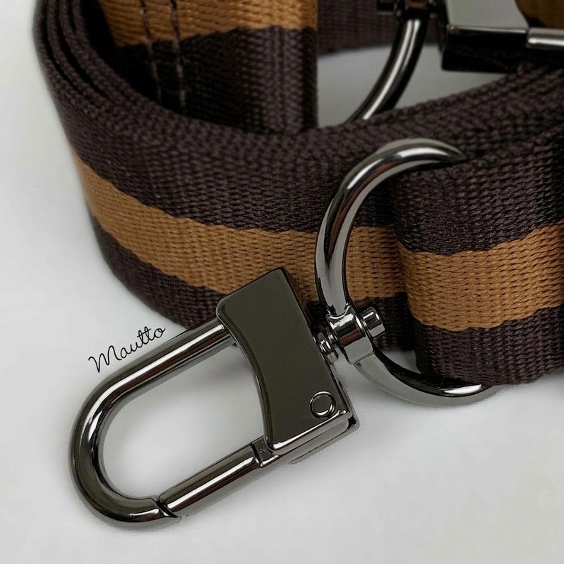 Brown and tan striped strap shown with gunmetal black hardware finish.