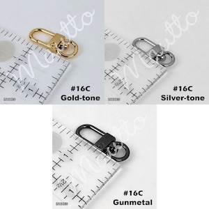 Swiveling clip options for petite leather wrist strap keychain accessory, in gold-tone, silver-tone or gunmetal black finish.