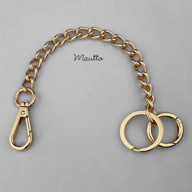 Luxury chain key fob tether and handbag accessory. Attachable clip and keyring / o-ring accessory, to secure your keys to your bag or clothing. Jewelry quality metal chain. Made by hand in the USA.