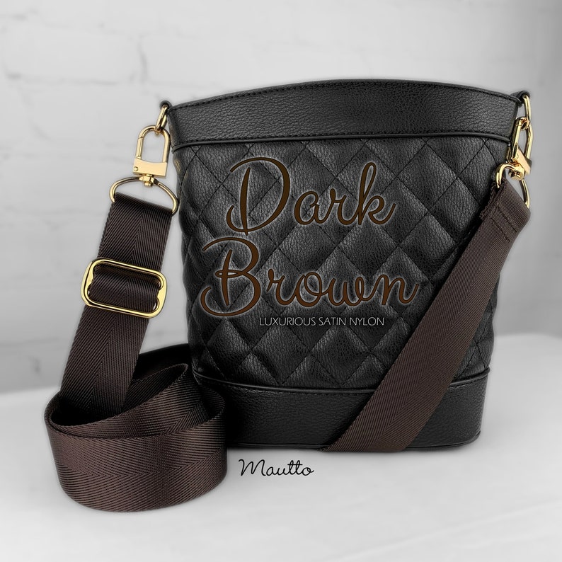 Photo of dark brown woven purse strap on purse. Adjustable shoulder to cross body length.