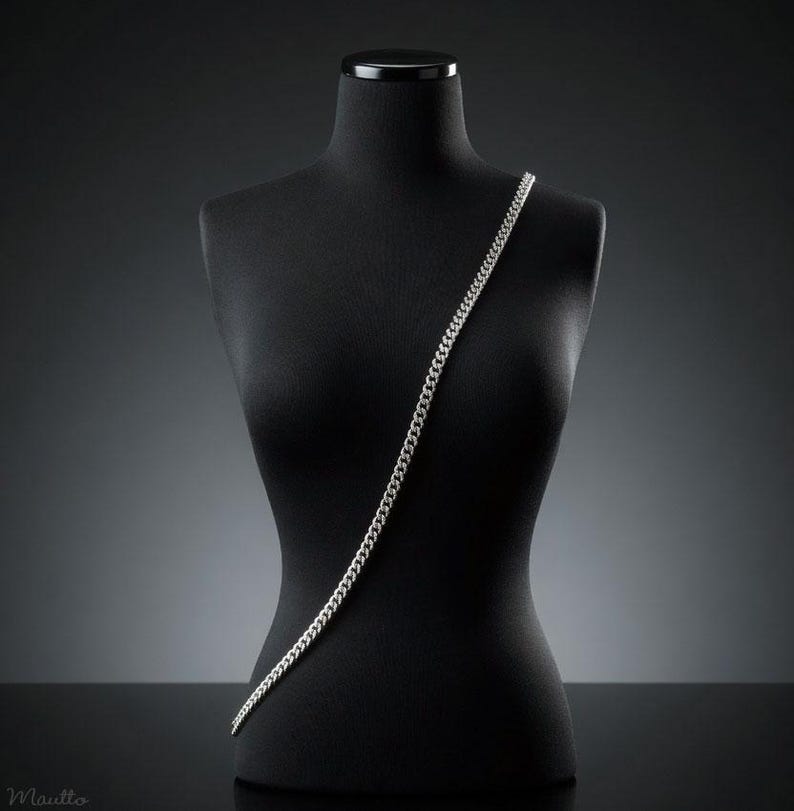 Silver fancy link chain straps for purses, handbags of all sizes and styles and phone cases. Shown on a mannequin in the cross body style.