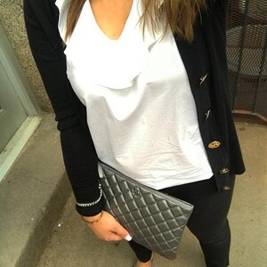 Photo from custom showing chain wrist strap connected to clutch.