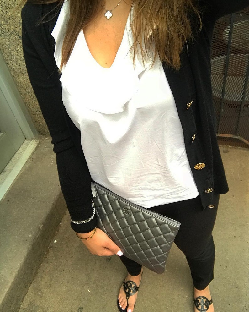 Photo from custom showing chain wrist strap connected to clutch.