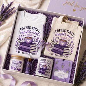 May include: A gift box with a white t-shirt and tote bag, both with a coffee and book design. Includes a mug, candle, essential oil, and lavender sachet. The theme is "Coffee First, Chapter Next". The box is filled with purple filler and lavender sprigs.