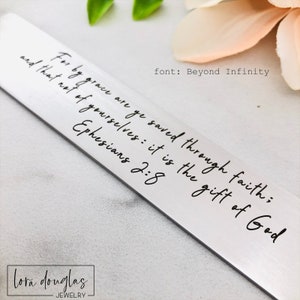 stainless steel bible verse bookmark with engraved scripture and optional front and back personalization, christian bookmark gift displayed with leather tassel and velvet pouch packaging