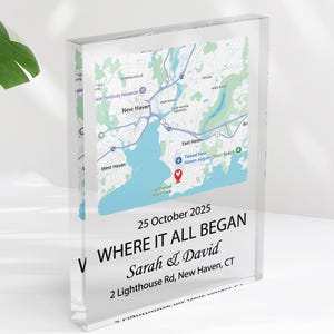 May include: A clear acrylic block featuring a map of New Haven, CT, with a blue and white design. The block includes the text "WHERE IT ALL BEGAN" and the date "25 October 2025", along with names and an address.