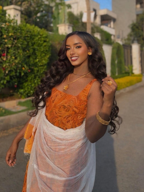 gold jewelry with orange dress Habesha Chiffon – Elegant Flowing Ethiopian Chiffon Kemis for Weddings and Evening Celebrations combination orange dress jewellery