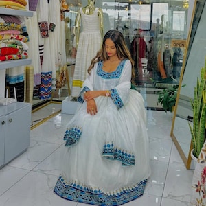 Traditional Habesha Kemis with Blue Tibeb – Handwoven Ethiopian Dress for Women