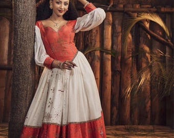 ethiopian dress designs Wedding | Green & Blue Embroidered Beaded Design | Handcrafted Luxury | Cultural Elegance | Habesha Dress Hab131 This gorgeous dress conjure up images of sublime elegance and beauty Orange Embroidery Elegant Habesha Dress