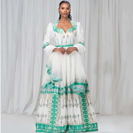 Green Habesha Kemis – Elegant Ethiopian Dress With Circular Patterns and Cross Tibeb