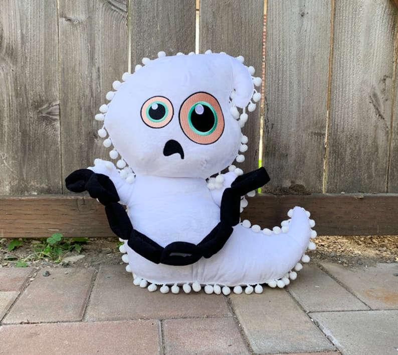plush ghost halloween plush pillow. halloween decoration spooky ghost plush with pompom fringe trim & plush chains & funny ghost face