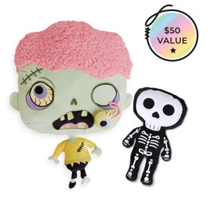 May include: A set of Halloween-themed plush toys. Includes a large zombie head pillow with pink brain detail, a small zombie figure in yellow, and a black and white skeleton plush. A circular tag reads "$50 VALUE".