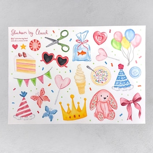 May include: A watercolour illustration featuring party-themed stickers. The design includes a cake slice, heart-shaped sunglasses, balloons, a bunny, a crown, and other festive elements. The text "Stickers by claud" is visible.