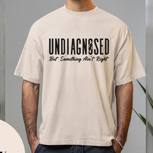 Comfort Colors® Undiagnosed But Something Ain’t Right Shirt, Funny Mental Health Shirt, Sarcastic Dark Humor Tee, Unstable and Aware T-Shirt
