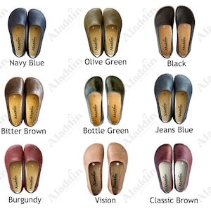 May include: A selection of leather slip-on shoes in shades such as navy blue, olive green, black, bitter brown, bottle green, jeans blue, burgundy, vision, and classic brown. Each pair is shown from above, displaying the sole and the Aladdin brand.