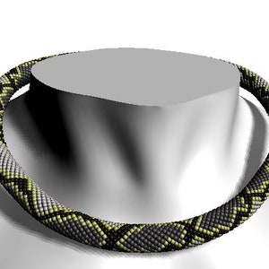 May include: A black, gray, and yellow beaded necklace with a snake skin pattern.