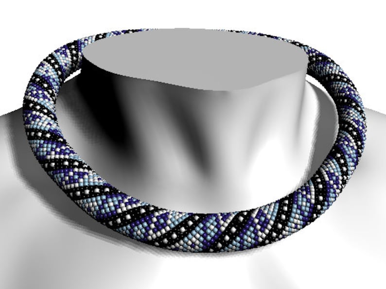 May include: A black, white, and blue beaded necklace with a geometric pattern. The necklace is made of small, round beads and is worn on a mannequin.