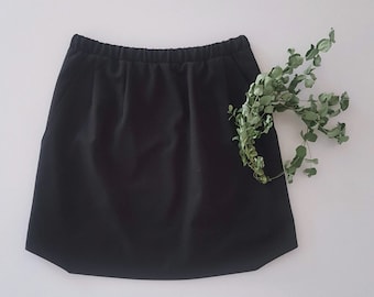 Women's classic mini skirt with elastic waist in navy or black suiting woven stretch. High waist. Side pockets. Lining. Made on request.