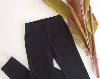 Women's classic straight pants black suiting or canvas. Side and back pockets. Adjusted leg. Office pants. Regular waistband. Stretch