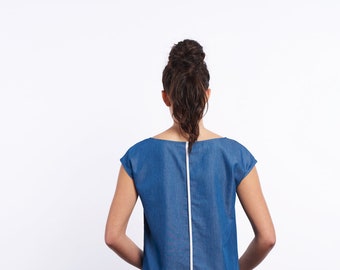 Women's back line top blue or black. Denim cotton Tencel. Minimalist round neckline blouse. Short sleeves. White contrast binding.
