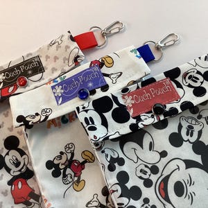 May include: A set of three ceramic mugs with a speckled, matte finish. The mugs are in shades of cream, light gray, and dark gray. Each mug has a simple, minimalist design, perfect for coffee or tea.