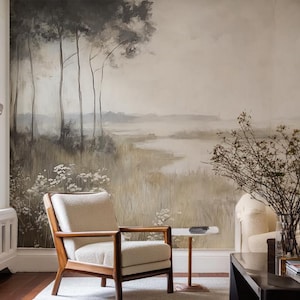 May include: A living room with a large landscape mural featuring trees and a body of water. Two cream-colored armchairs with wooden frames face the mural. A dark wood coffee table and a light-colored rug complete the scene.