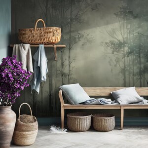 May include: A wooden bench with two cushions and three woven baskets in front of a wall mural depicting a misty forest scene.