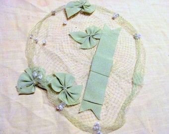 green netting with green grosgrain ribbon bows