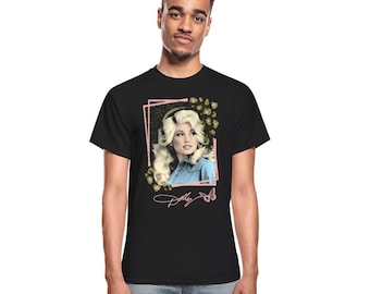 May include: Black t-shirt with a graphic of Dolly Parton in a blue shirt with a pink floral frame and her signature.