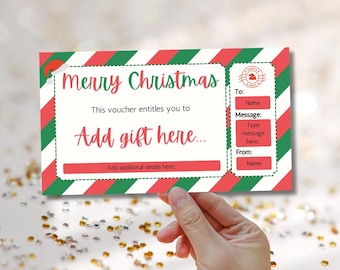 Può includere: Un buono regalo di Natale a strisce rosse e verdi con il testo "Buon Natale" e "Aggiungi regalo qui..." Il buono ha campi per "A:", "Messaggio:" e "Da:".