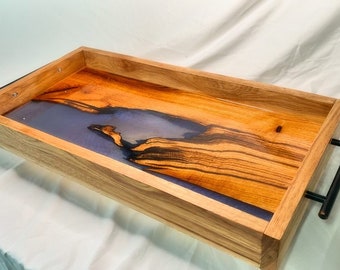 May include: A wooden serving tray with black metal handles. The tray has a natural wood finish and a purple resin inlay.