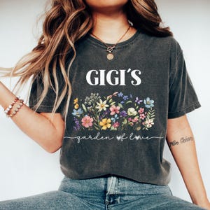 Model wearing pepper personalized grandma shirt with floral garden design – sweet and thoughtful gift for Gigi.