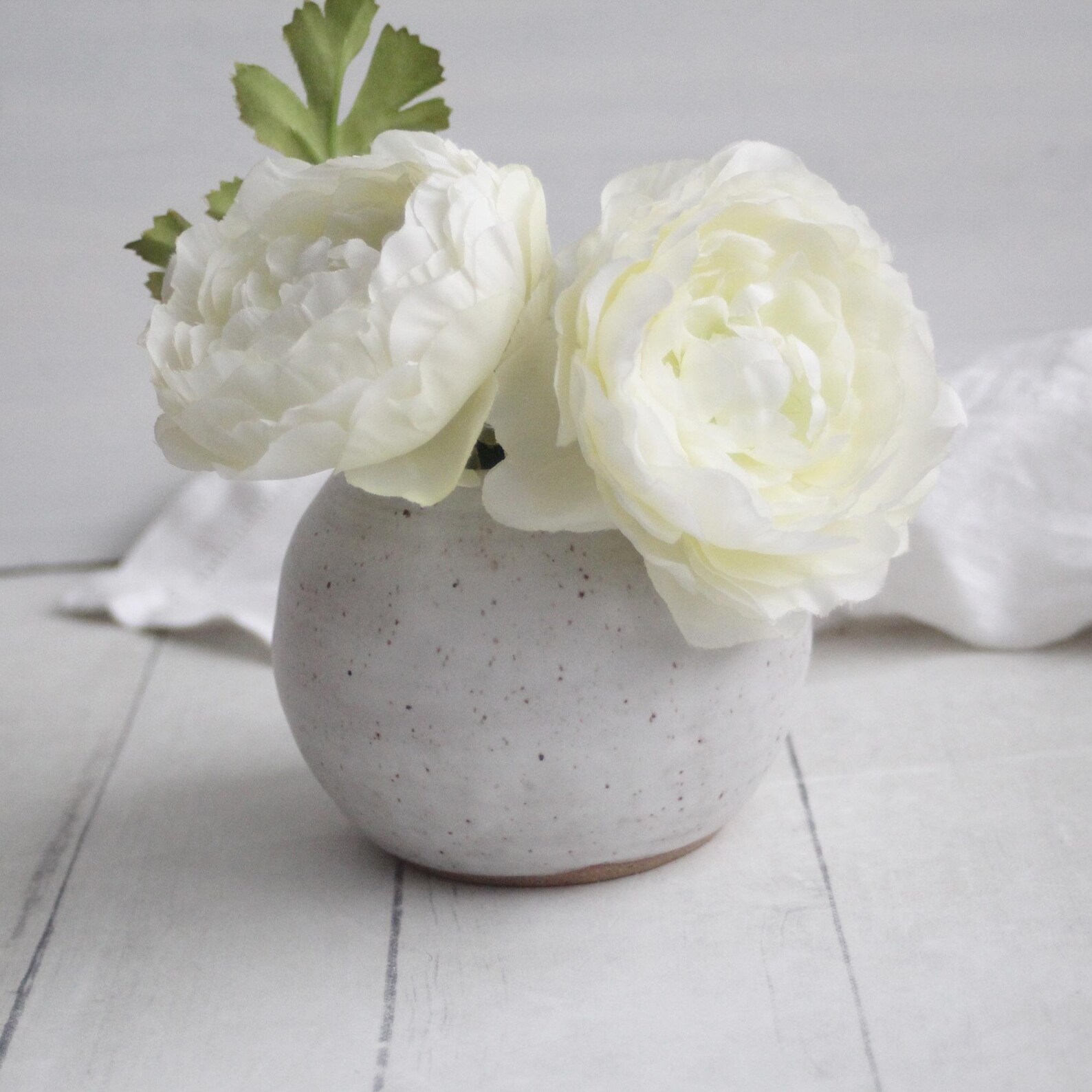 Round white speckled ceramic vase for a cowgirl coastal kitchen
