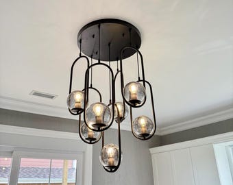 Blown Glass Pendant Lamp: Modern Oval Black Metal Frame