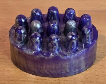 Masajeador corporal de resina morada y plateada