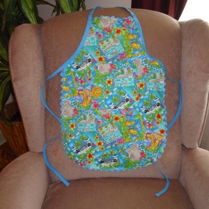 Child&#39;s Summer Apron with Trees and Animals and Fun