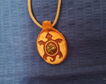 Mimbres turtle found on pottery in the Mimbres valley,N.M. 1000 AD. Turtle has natural turquoise center nugget.