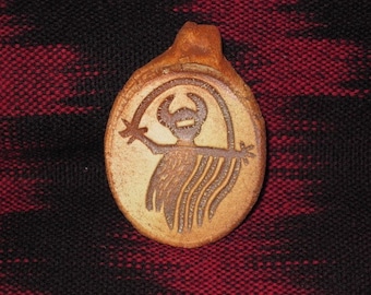 Man Holding Rainbow Rock Art Clay Pendant