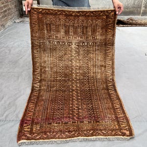 Vintage Baluch 2.10x4.5 ft hand-knotted tribal rug — warm brown & ivory geometric field, low-pile wool, perfect for entry, bedside or layer
