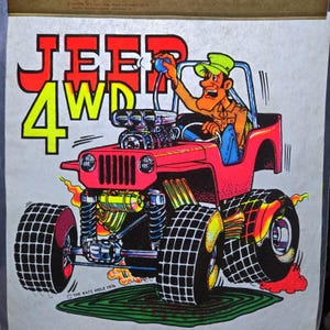 May include: A vintage cartoon illustration of a red Jeep 4WD with large tires, flames, and a driver. The text "JEEP 4WD" is in red and yellow. The illustration includes the text "THE RATS HOLE 1976".