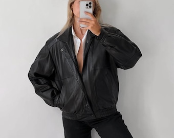 Oversized zwart leren bomberjack uit de jaren 90, recht schapenleer