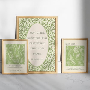May include: Three framed prints with green botanical illustrations and inspirational quotes. The top print says "Above all else, guard your heart, for everything you do flows from it.  Proverbs 4:23". The middle print says "Only by returning to me and resting in me will you be saved. In quietness and confidence is your strength. Isaiah 30:15". The bottom print says "Peace I leave with you; my peace I give you. I do not give to you as the world gives. Do not let your hearts be troubled and do not be afraid. John 14:27".