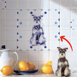 May include: White ceramic tiles featuring a blue and white Schnauzer dog design. The tiles are arranged in a grid, with a central image of the dog. Blue diamond accents are scattered across the tiles. A white jug and lemons are in the foreground.