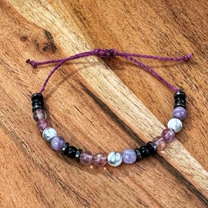 Empath protection bracelet with black tourmaline, howlite, fluorite, and amethyst beads