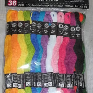 May include: A package of 36 skeins of pastel embroidery floss. Each skein is 8.75 yards long. The floss colors include orange, yellow, green, blue, purple, white, pink, red, black, and green. The package has text that says "Embroidery Floss" and "Pastel".