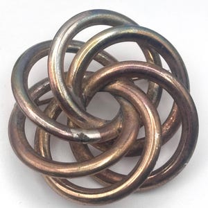 May include: A white ceramic mug with a black handle and the text "But First, Coffee" in a handwritten style. The mug is on a white surface. The mug is approximately 4 inches tall.