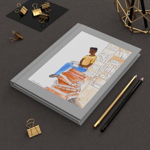 Cuaderno de escritura de tapa dura - Diseño de un joven negro leyendo, diario de reflexión para inspirarse y crear. imagen 9