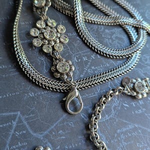 Vintage Brighton style silver-tone chain belt with flowers crystal station details and lobster clasp, XL length measuring up to 43 inches end to end.